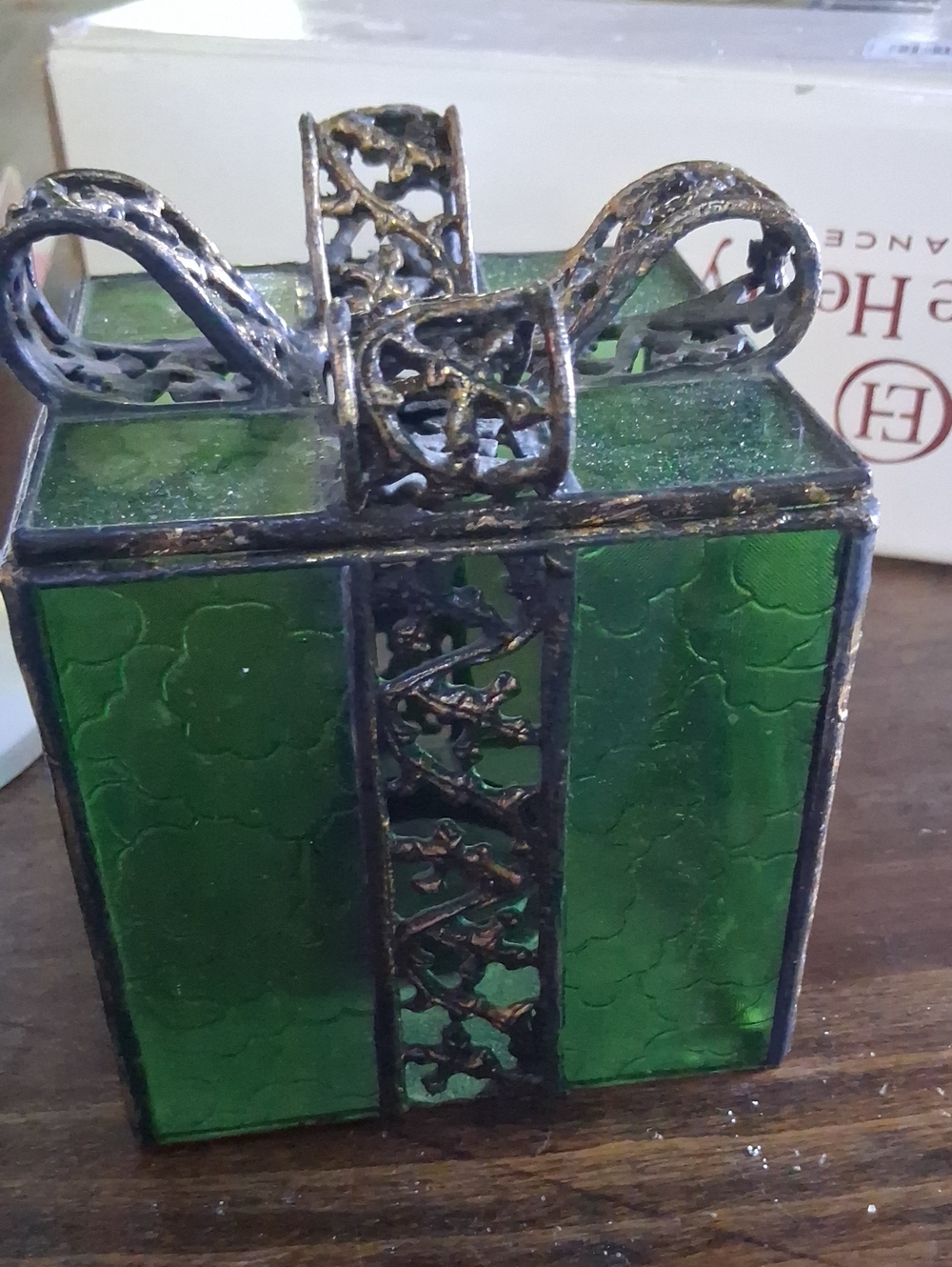 green stained glass present-shaped candle holder